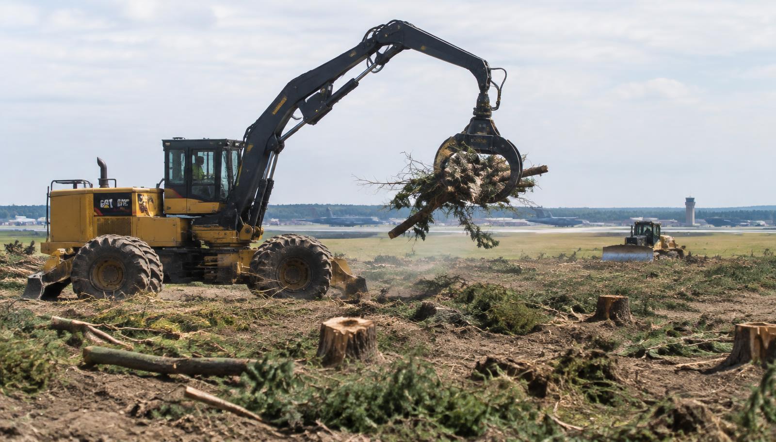Representative image of heavy equipment clearing trees and stumps on an airfield site