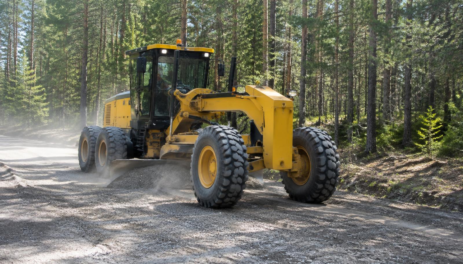 Representative image of a motor grader maintaining a gravel forest road